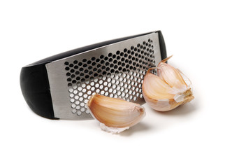 Garlic and garlic Press on white background
