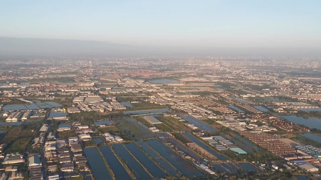 View through an Airplane window during approach in Bangkok, Thailand