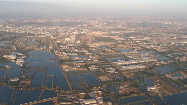 View through an Airplane window during approach in Bangkok, Thailand
