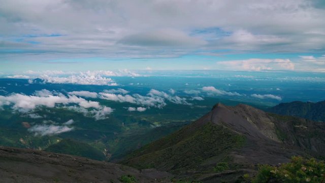 Time-lapse Cinemagraph / seamless video loop of the impressive Irazu Volcano Crater at Cartago, Costa Rica. Clouds are moving across the land the view is upon the Caribbean Sea.