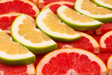 Pomelo and grapefruit slices background.