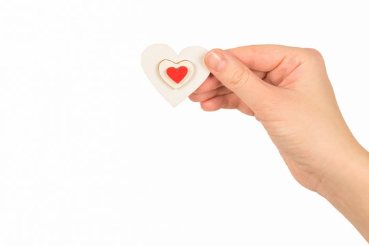 Red heart in woman hand isolated.