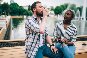 Couple enjoying date in park and talking