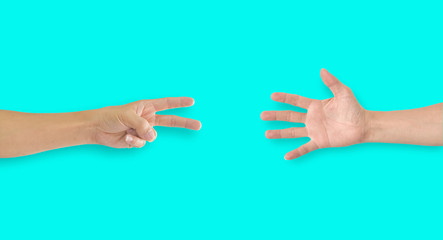 Two hands playing rock-paper-scissors on blue background