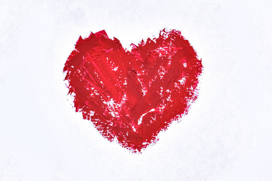 Shape of heart drawn with lipstick on a white background. Offering love for Valentines and Mother's day concept.