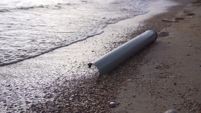 Water pollution plastic pipe at a coast