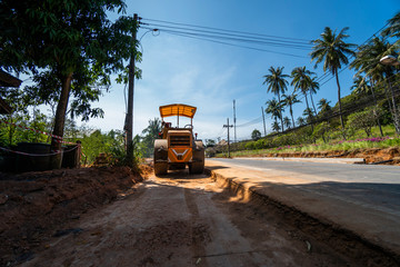 Road rollers working on the new roads construction site. Heavy duty machinery working on highway. Construction equipment. Compaction of the road.