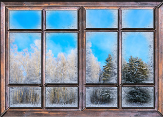 the window is covered with ice frost