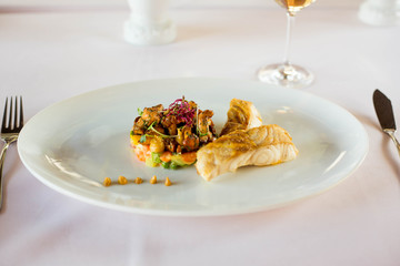 baked white filet fish and vegetables