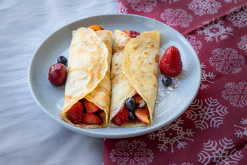 Crepes with Fresh Berries, Chocolate Sauce and Powdered sugar