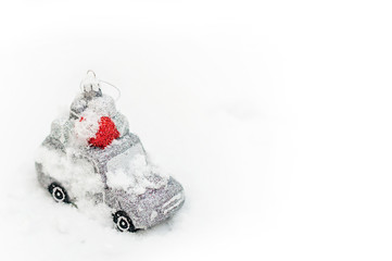 Beautiful christmas car toy lying on snow.