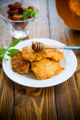 tasty fried sweet pumpkin pancakes with honey