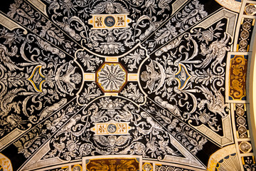 Ornateceiling in the neopolitain tradition in a building in the centreof Budapest in Hungary