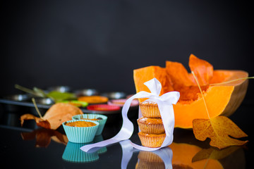 baked sweet pumpkin muffins with dried apricots inside