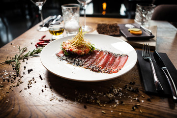 Tuna sashimi served on a plate in restaurant