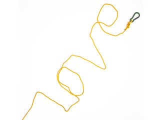 The word "love" written by rope with carabiner isolated on white background. Figure eight knot with green carabiner on yellow rope.