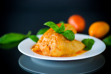 stuffed pepper with meat and vegetable sauce in a plate