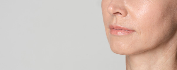 Perfect natural lips of middle aged woman