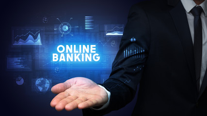 Hand of Businessman holding ONLINE BANKING inscription, business success concept