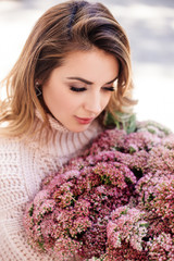 Image of cute woman with bouquet