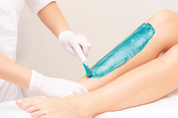 azulene depilation. wax hair removal, shugaring. concept of smooth skin without hair. azulene of...