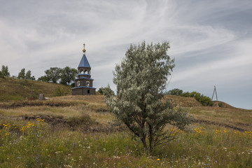 Fototapeta na wymiar church standing on a hill