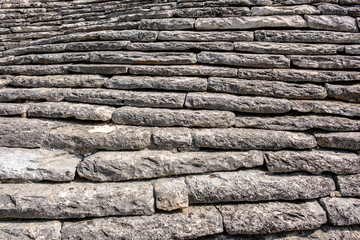 Stone roof trullo, fragment. Background. Alberobello, Italy.