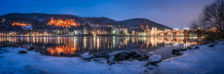 Frozen Neckar river and Heidelberg castle in winter