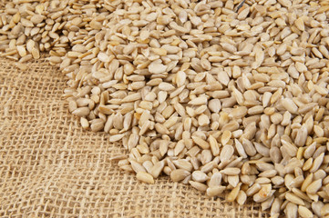 Sunflower seeds on jute background