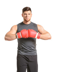 Sporty young boxer on white background