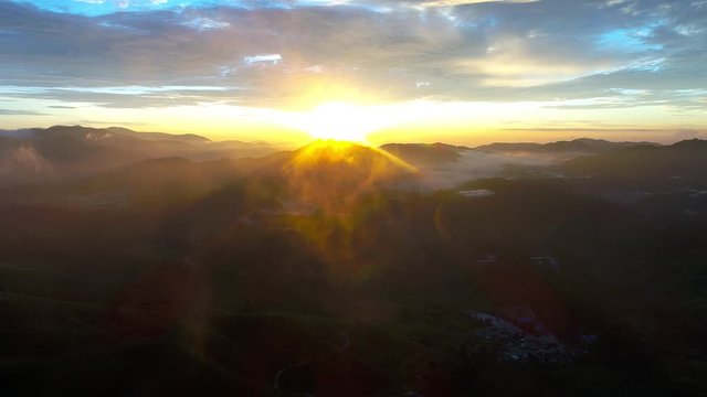 Aerial dramatic sunrise by drone at TEA Plantation, Sg. Palas, Cameron Highlands, Pahang. Malaysia.
