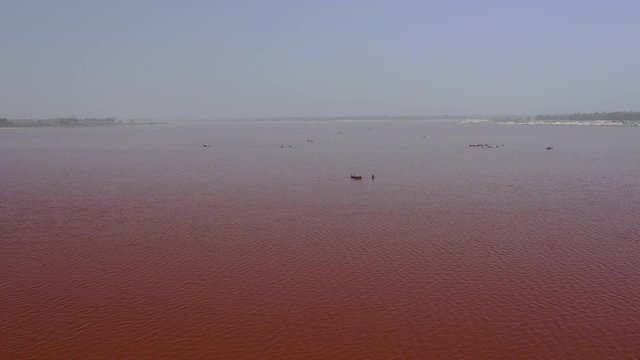 Aerial view of the pink Lake Retba or Lac Rose in Senegal. Photo made by drone from above. Africa Natural Landscape.