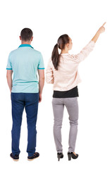 Fototapeta premium Back view of a stylish couple pointing.