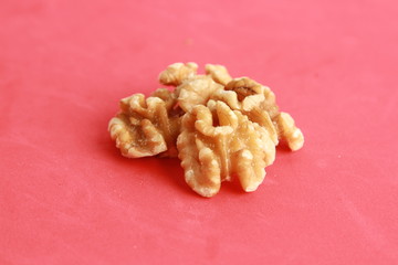 Peeled walnuts in colorful background