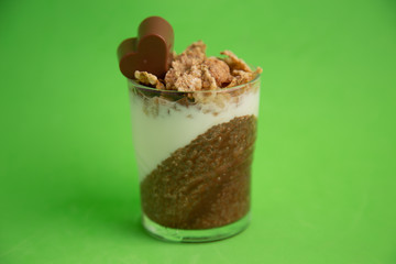 Delicious breakfast, cocoa chia pudding with yogurt and cereals