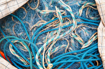 Blue ropes and fishing net in the big sack
