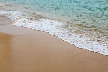 Fototapeta na wymiar Soft waves of clear sea water on beautiful beaches.