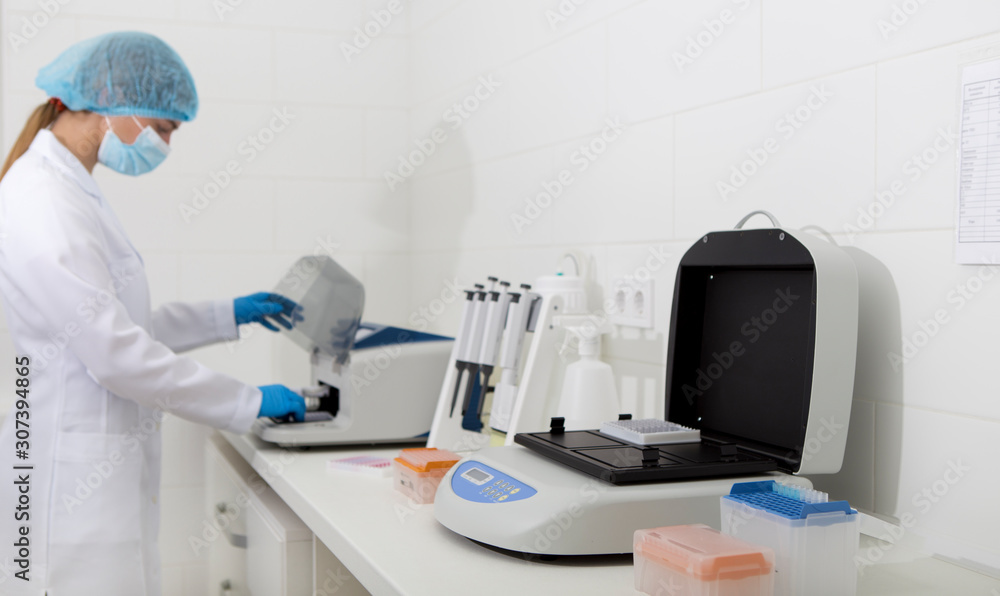 Poster girl lab assistant getting results of analysis from printer