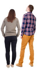 Fototapeta premium Back view of couple. beautiful friendly girl and guy together.