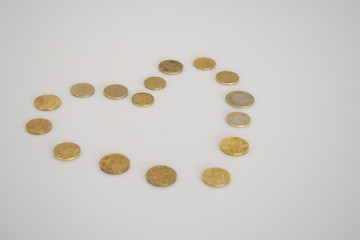 coins on white background love