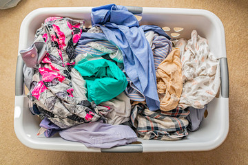 Pile of Freshly washed clothes in a washing basket