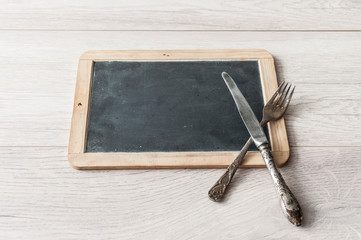 menu blackboard frame on wooden dinning table
