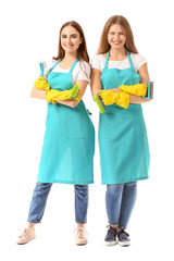 Female janitors on white background
