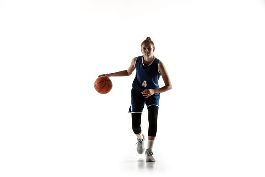 Young caucasian female basketball player of team in action, motion in run isolated on white background. Concept of sport, movement, energy and dynamic, healthy lifestyle. Training, practicing.