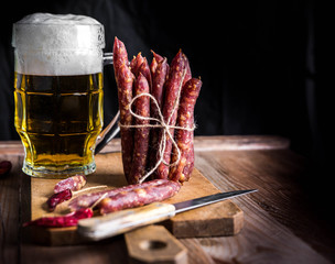 Thin uncooked smoked pork and beef sausages. Delicatessen meat.