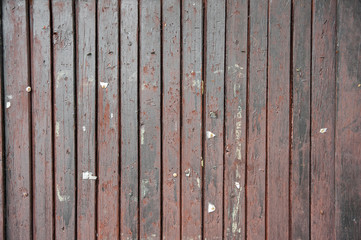 Surface of wooden information table with old staples and tacks