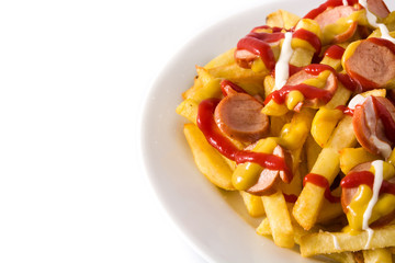 Typical Latin America Salchipapa. Sausages with fries, ketchup, mustard and mayo  isolated on white background. Copy space