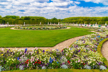 Lovely view of the Latona Parterre in the famous Gardens of Versailles on a summer day. The...