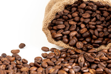 Black arabica, robusta coffee beans isolated on white background with copyspace for text/ Selective focus