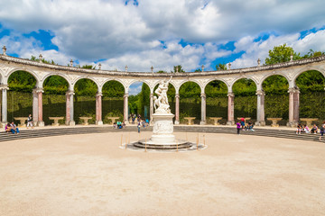 Lovely view of the Colonnade, a circular arched double peristyle in the Gardens of Versailles on a...